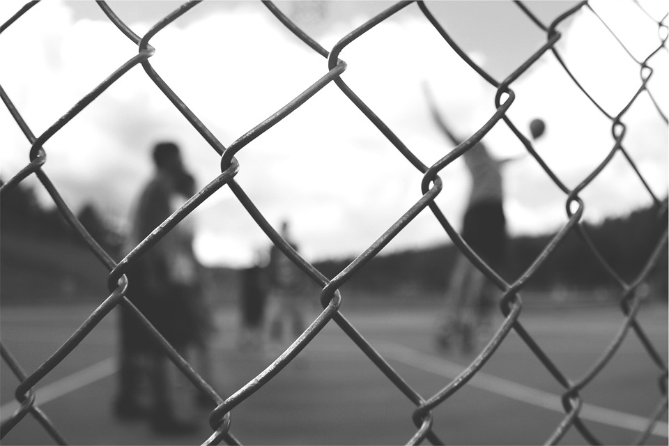 image - chainlink fence around basketball game