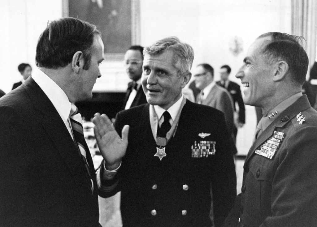 Washington, D.C. (March 4, 1976) – Medal of Honor recipient Rear Adm. James B. Stockdale, center, chats with guests including Assistant Commandant of the U. S. Marine Corps, Lt. General Samuel J. Jaskilka, right, following his award ceremony in the East Room of the White House. U.S. Navy photo by Dave Wilson (RELEASED)